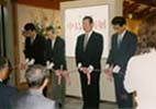 A tape cutting ceremony with the mayor of Uozu Town 